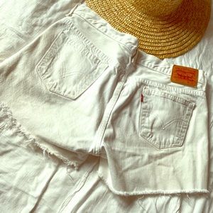 Levi’s vintage white button fly cut off shorts.